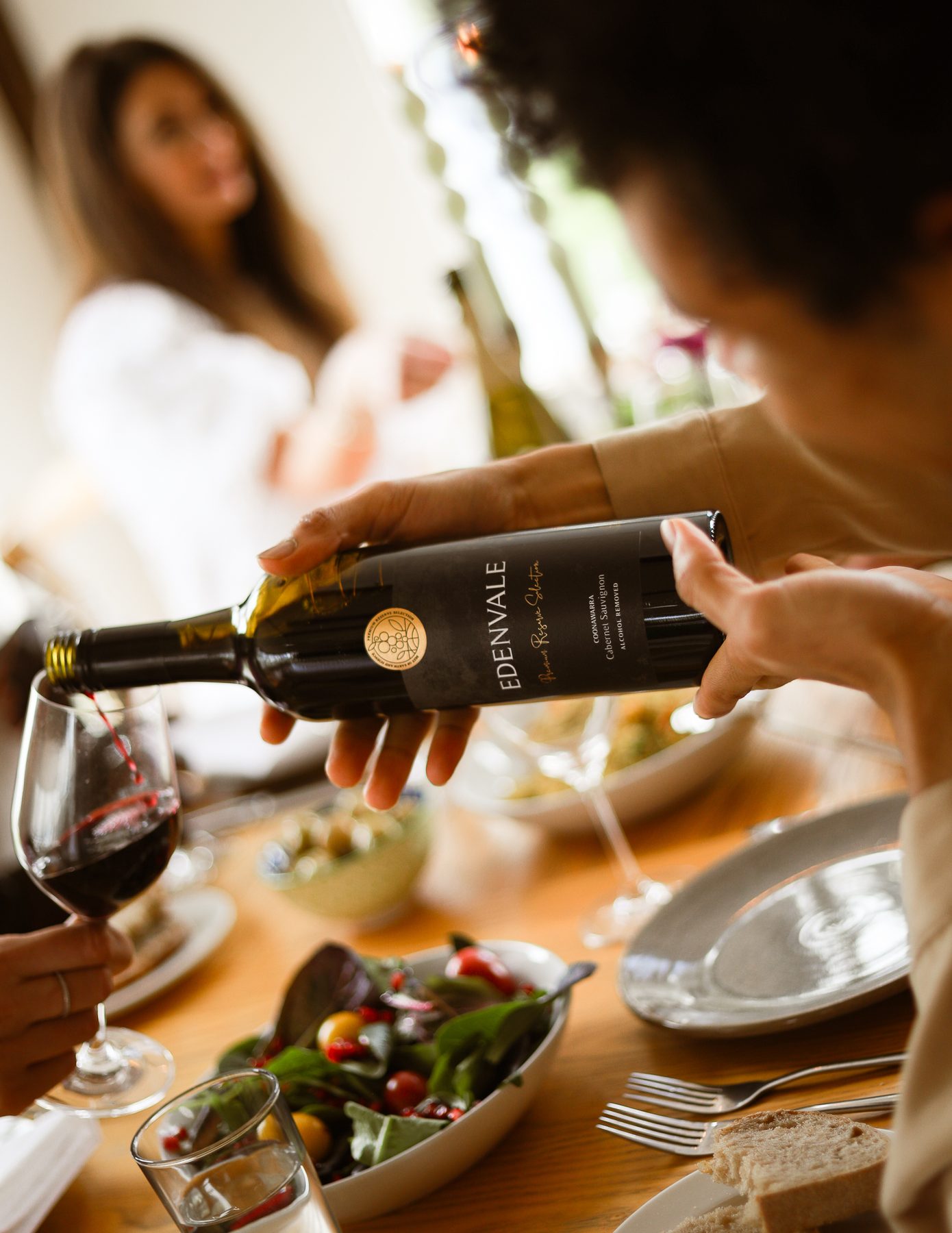 Pouring Edenvale Premium Reserve Cabernet Sauvignon at a long lunch