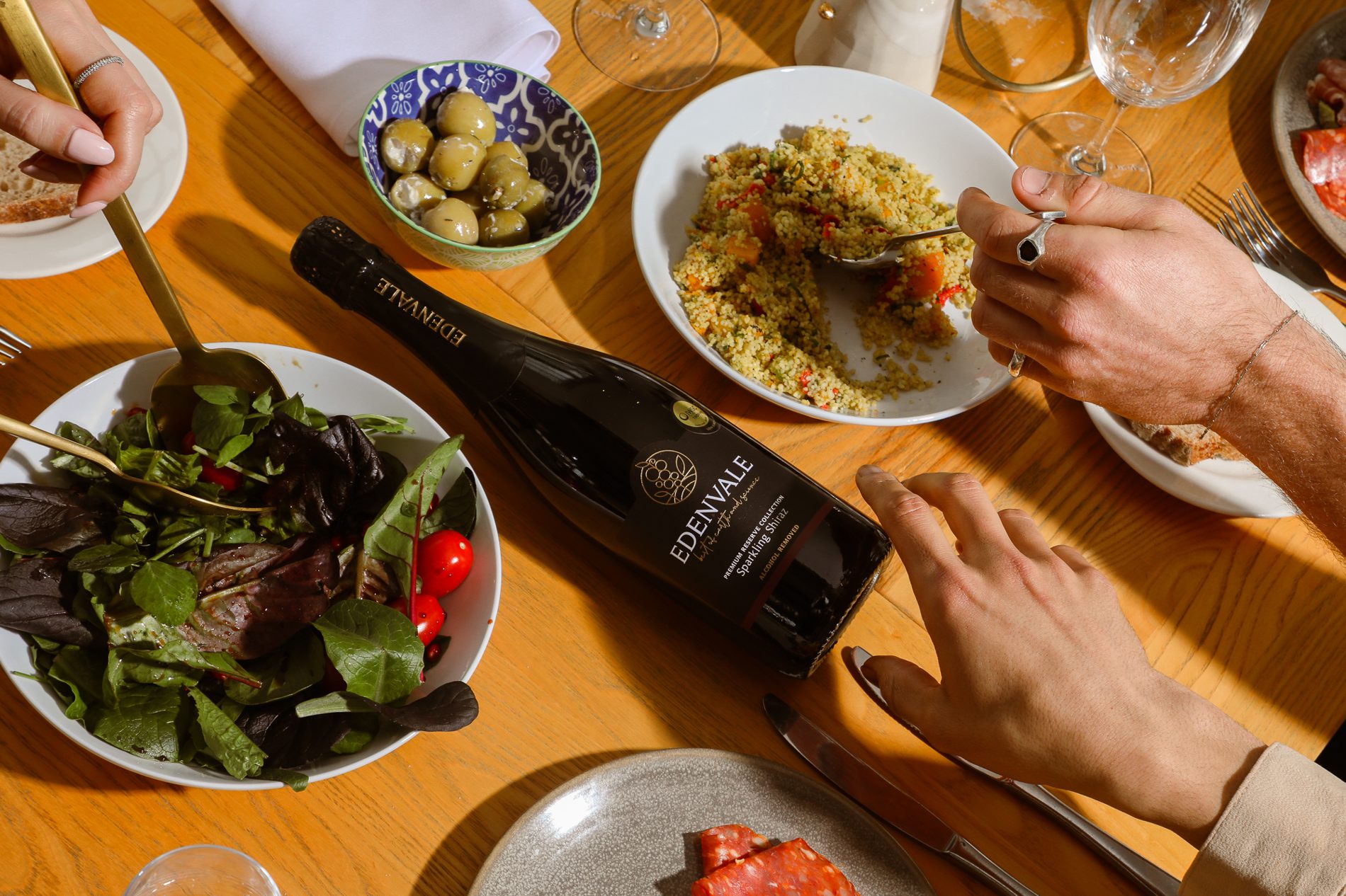 Edenvale Premium Reserve Sparkling Shiraz on a lunch table with salads