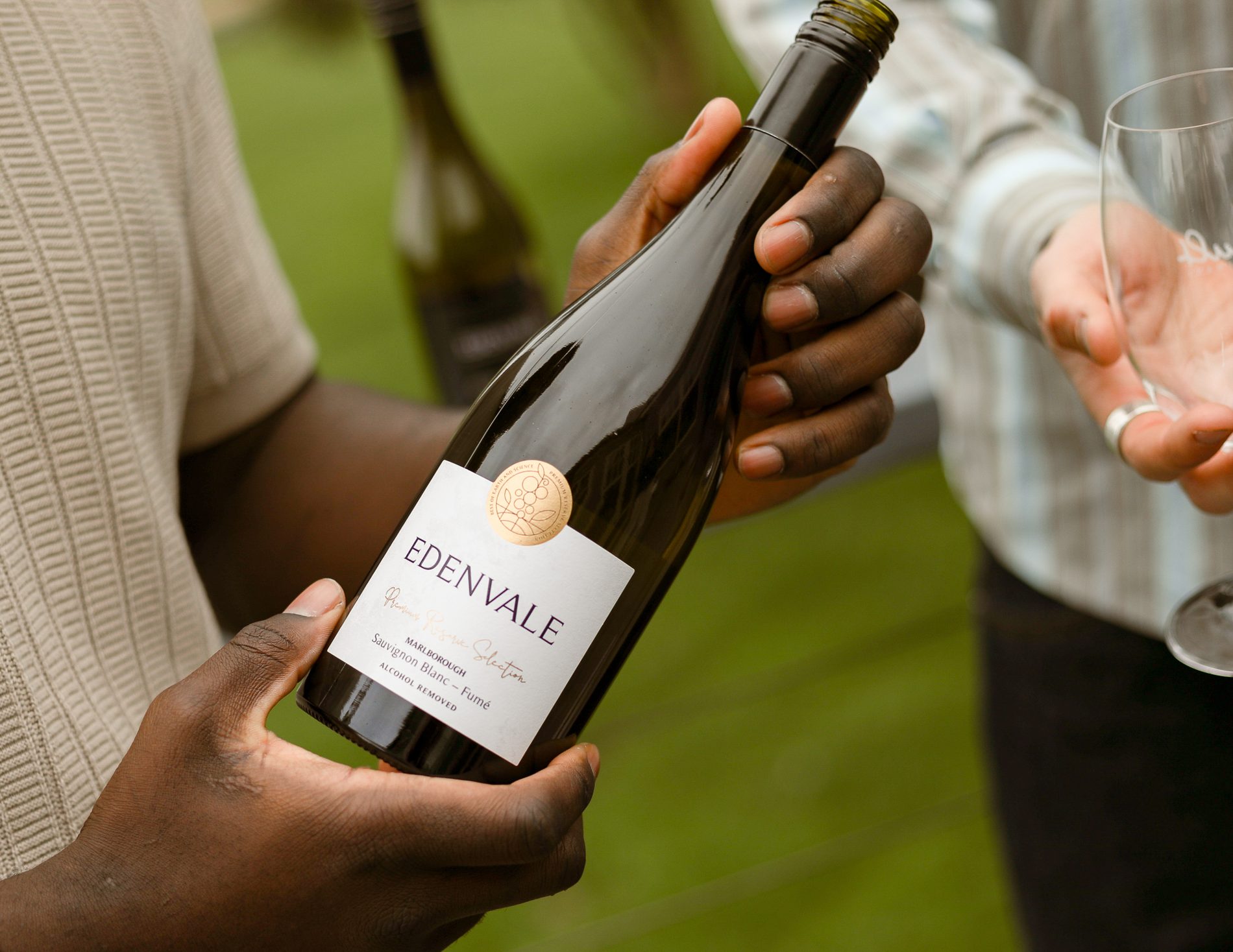 Pouring Edenvale Marlborough Sauvignon Blanc Fume outdoors