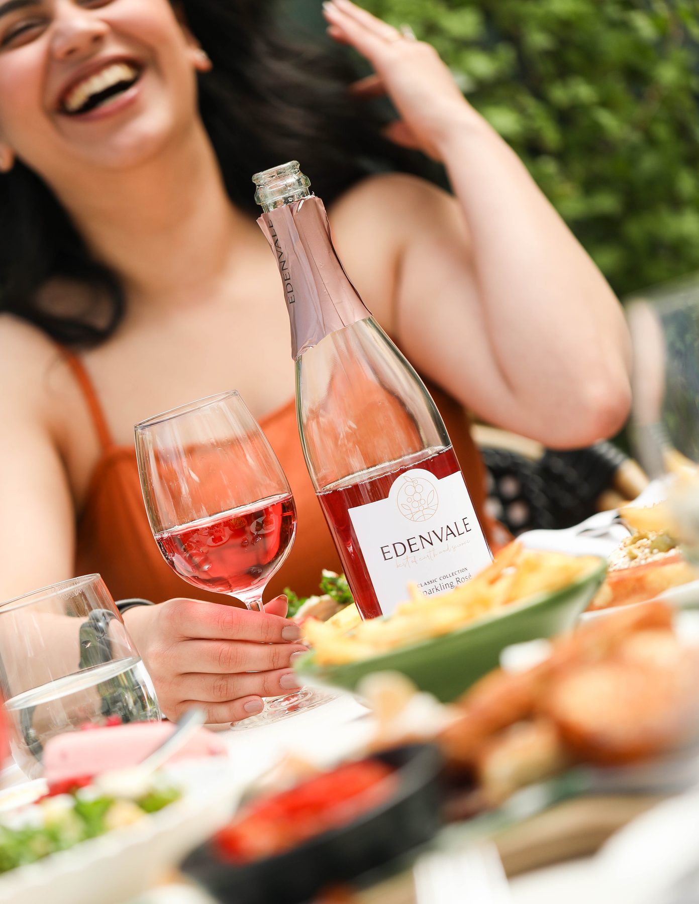 Edenvale Sparkling Rose with a glass of rose at an outdoor lunch