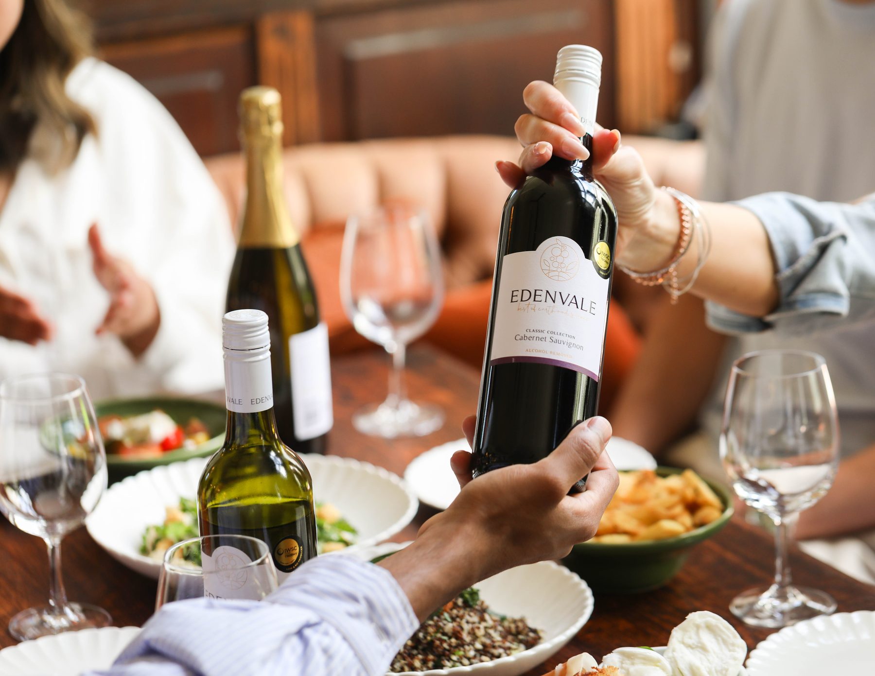 Friends sharing Edenvale wines around the table